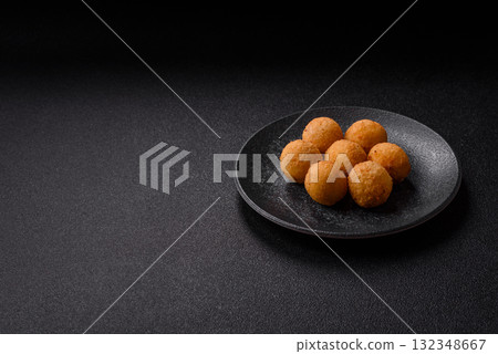 Cheese balls, croquettes or arancini with potatoes or rice. Cheese balls 132348667