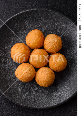 Cheese balls, croquettes or arancini with potatoes or rice. Cheese balls Cheese balls, croquettes or arancini with potatoes or rice. Cheese balls 132348674