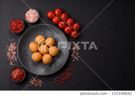 Cheese balls, croquettes or arancini with potatoes or rice. Cheese balls 132348682