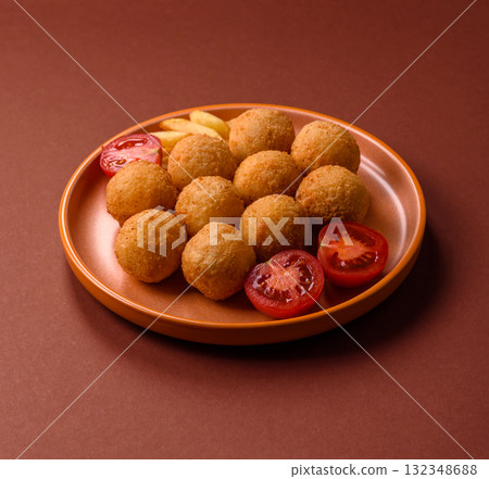 Cheese balls, croquettes or arancini with potatoes or rice. Cheese balls 132348688