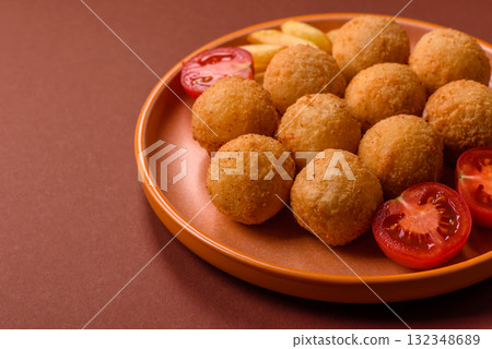 Cheese balls, croquettes or arancini with potatoes or rice. Cheese balls 132348689