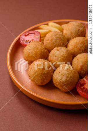 Cheese balls, croquettes or arancini with potatoes or rice. Cheese balls 132348691