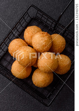 Cheese balls, croquettes or arancini with potatoes or rice. Cheese balls Cheese balls, croquettes or arancini with potatoes or rice. Cheese balls 132348705