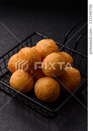 Cheese balls, croquettes or arancini with potatoes or rice. Cheese balls Cheese balls, croquettes or arancini with potatoes or rice. Cheese balls 132348706