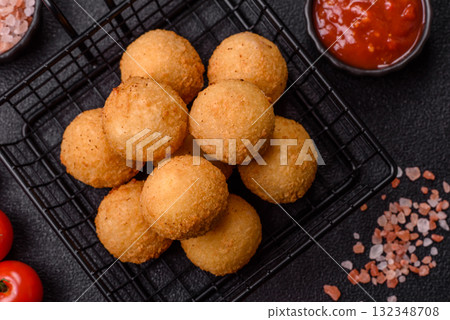 Cheese balls, croquettes or arancini with potatoes or rice. Cheese balls Cheese balls, croquettes or arancini with potatoes or rice. Cheese balls 132348708