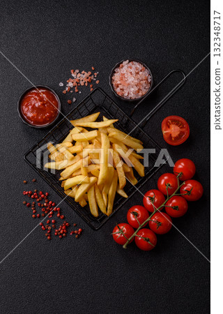 French fries, chips or snack with sauce as food background. French fries 132348717