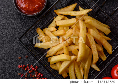 French fries, chips or snack with sauce as food background. French fries 132348720