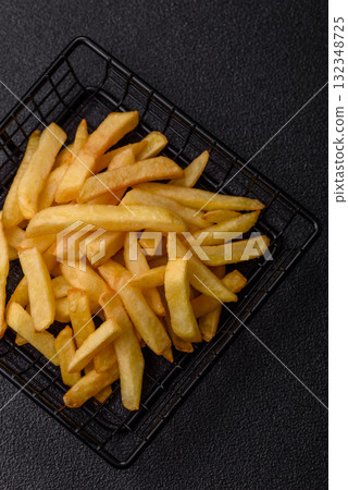 French fries, chips or snack with sauce as food background. French fries 132348725