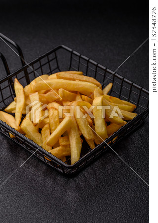 French fries, chips or snack with sauce as food background. French fries 132348726