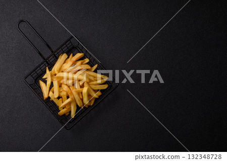 French fries, chips or snack with sauce as food background. French fries 132348728