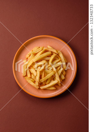 French fries, chips or snack with sauce as food background. French fries French fries, chips or snack with sauce as food background. French fries 132348733