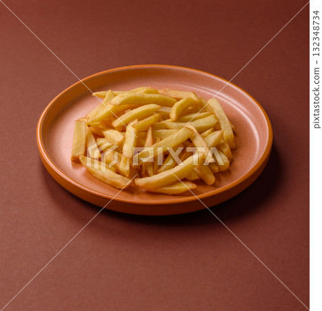 French fries, chips or snack with sauce as food background. French fries French fries, chips or snack with sauce as food background. French fries 132348734