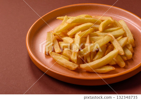 French fries, chips or snack with sauce as food background. French fries French fries, chips or snack with sauce as food background. French fries 132348735