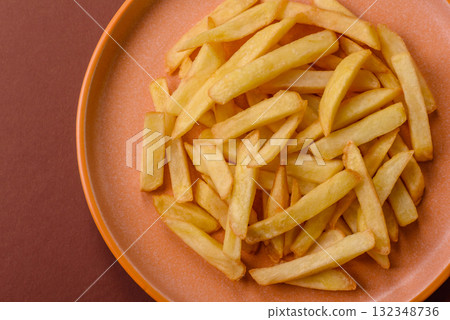 French fries, chips or snack with sauce as food background. French fries French fries, chips or snack with sauce as food background. French fries 132348736