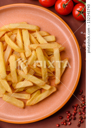French fries, chips or snack with sauce as food background. French fries 132348740