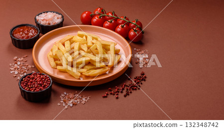 French fries, chips or snack with sauce as food background. French fries 132348742