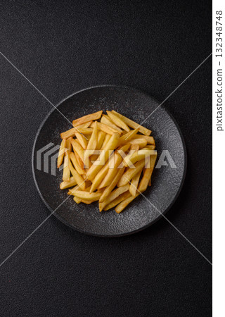 French fries, chips or snack with sauce as food background. French fries 132348748