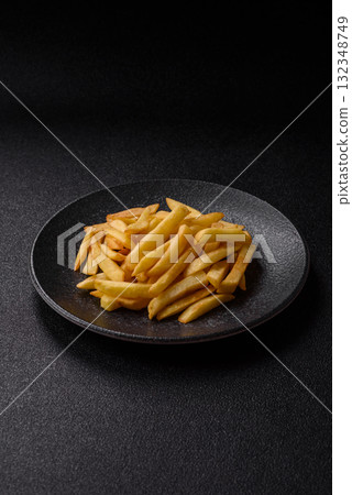 French fries, chips or snack with sauce as food background. French fries 132348749