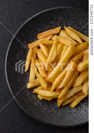 French fries, chips or snack with sauce as food background. French fries 132348752