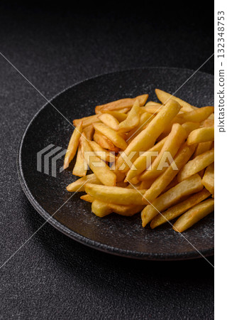 French fries, chips or snack with sauce as food background. French fries 132348753