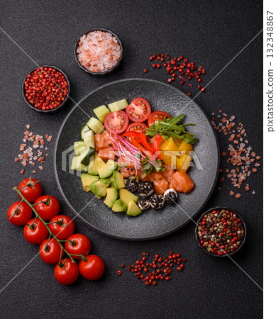 Bowl with salmon pieces, cheese, tomatoes, peppers and avocado. Salmon bowl 132348867