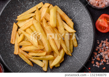 French fries, chips or snack with sauce as food background. French fries 132348870