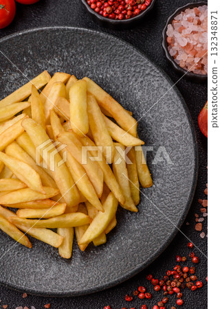 French fries, chips or snack with sauce as food background. French fries 132348871