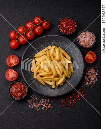 French fries, chips or snack with sauce as food background. French fries 132348875