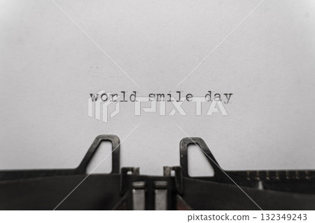 world smile day typed words on a vintage typewriter 132349243