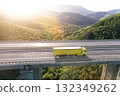 Yellow cargo delivery truck drive on highway aerial view 132349262