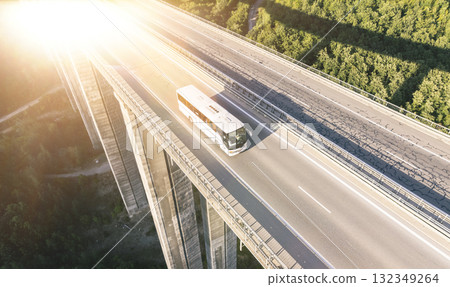 a bus full of passengers moving on the highway 132349264