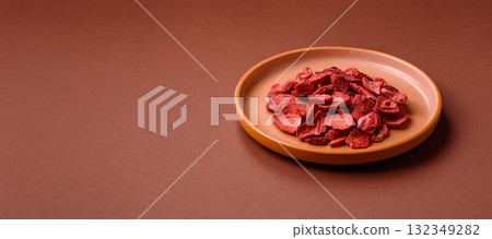 Dried sublimated slices of strawberry as an ingredient for sweet desserts. Dried strawberry Dried sublimated slices of strawberry as an ingredient for sweet desserts. Dried strawberry 132349282