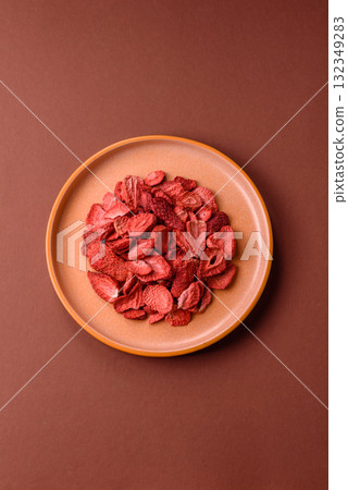 Dried sublimated slices of strawberry as an ingredient for sweet desserts. Dried strawberry 132349283