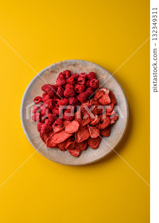 Dried sublimated slices of strawberry and raspberry as an ingredient for desserts. Dried strawberry Dried sublimated slices of strawberry and raspberry as an ingredient for desserts. Dried strawberry 132349311