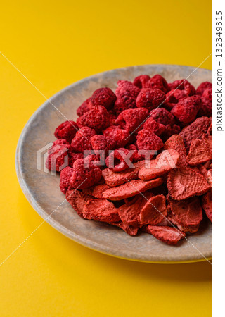 Dried sublimated slices of strawberry and raspberry as an ingredient for desserts. Dried strawberry Dried sublimated slices of strawberry and raspberry as an ingredient for desserts. Dried strawberry 132349315