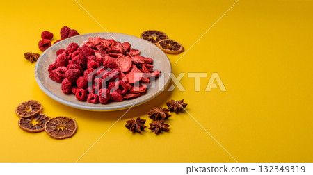 Dried sublimated slices of strawberry and raspberry as an ingredient for desserts. Dried strawberry 132349319