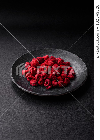 Dried sublimated slices of raspberry as an ingredient for sweet desserts. Dried raspberry 132349326