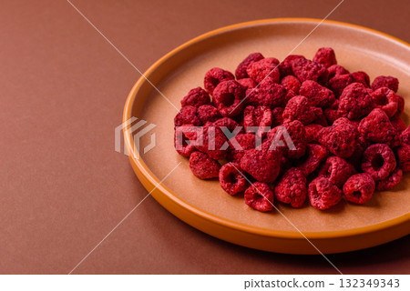 Dried sublimated slices of raspberry as an ingredient for sweet desserts. Dried raspberry 132349343