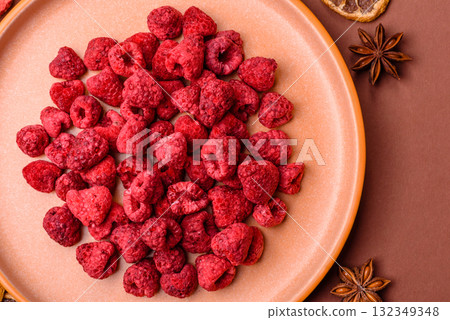 Dried sublimated slices of raspberry as an ingredient for sweet desserts. Dried raspberry 132349348