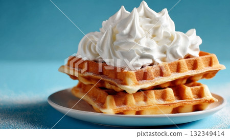 Waffles stacked with whipped cream, realistic style, on plate with blue background. 132349414