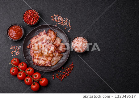 Cooked crispy fried pork bacon strips for a hearty breakfast. Fried bacon strips 132349517