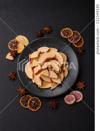 Dried sublimated slices of peach or apricot as an ingredient for sweet desserts. Dried peach Dried sublimated slices of peach or apricot as an ingredient for sweet desserts. Dried peach 132349580
