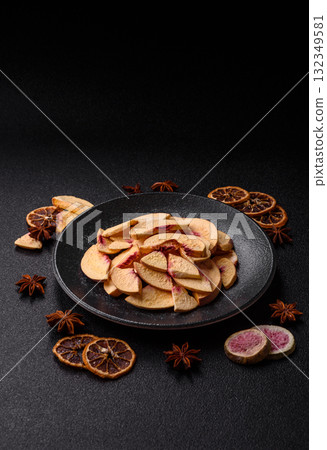 Dried sublimated slices of peach or apricot as an ingredient for sweet desserts. Dried peach 132349581
