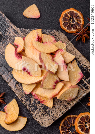 Dried sublimated slices of peach or apricot as an ingredient for sweet desserts. Dried peach Dried sublimated slices of peach or apricot as an ingredient for sweet desserts. Dried peach 132349603