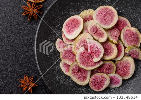Dried sublimated fig slices as an ingredient for sweet desserts. Dried figs 132349614
