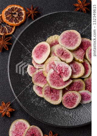Dried sublimated fig slices as an ingredient for sweet desserts. Dried figs Dried sublimated fig slices as an ingredient for sweet desserts. Dried figs 132349615