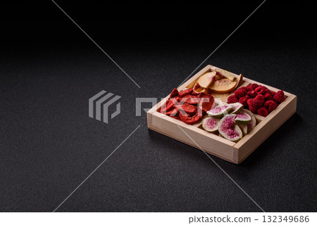 Box of dried fruits strawberries, raspberries, figs and peaches. Dried fruits 132349686
