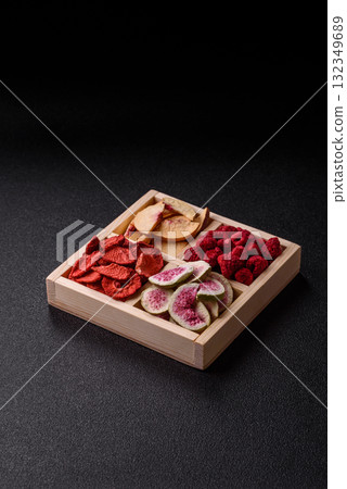 Box of dried fruits strawberries, raspberries, figs and peaches. Dried fruits Box of dried fruits strawberries, raspberries, figs and peaches. Dried fruits 132349689