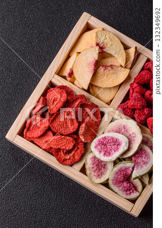 Box of dried fruits strawberries, raspberries, figs and peaches. Dried fruits 132349692