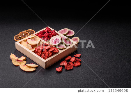 Box of dried fruits strawberries, raspberries, figs and peaches. Dried fruits Box of dried fruits strawberries, raspberries, figs and peaches. Dried fruits 132349698